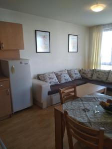 a living room with a couch and a table at Nessebar, Apartment,South Beach, Larisa, in Nesebar