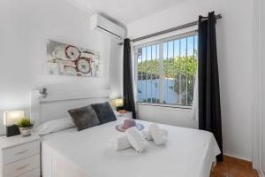 A bed or beds in a room at Villa Anais - PlusHolidays Még 36 kép