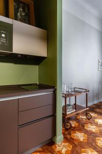 a kitchen with a counter top and a table at Broggi 22 in Milan