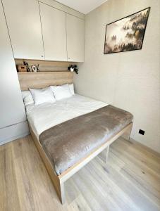 Postel nebo postele na pokoji v ubytování Pine Point Apartament with shared Pools, Jacuzzi, Sauna & Gym