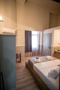 Cama o camas de una habitación en City Loft 3 (Stamatina's Luxury Apartments)