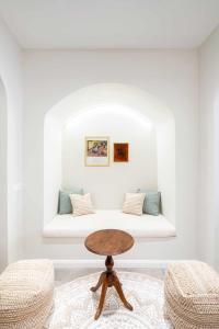 a room with a bed with a table in it at Casa de Playa Ideal para familias in Arenys de Mar