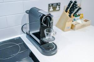 a toaster sitting on top of a kitchen counter at Deluxe Studio Apartment with Private Balcony in Stony Middleton