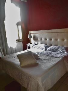 Lova arba lovos apgyvendinimo įstaigoje Boutique Hotel Palazzo Dei Vescovi