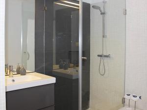 a bathroom with a shower with a sink and a toilet at Villa Vale Garrão in Almancil +9 photos