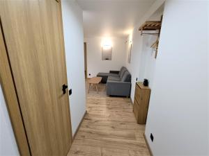 a hallway with a door leading to a living room at Jõhvi Home in Jõhvi