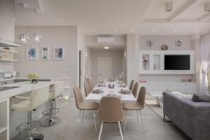 a kitchen and living room with a table and chairs at Villa Rose Nin ZadarVillas in Nin +37 photos
