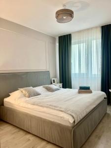 Ένα ή περισσότερα κρεβάτια σε δωμάτιο στο Noa Residence