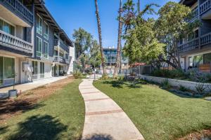 a walkway between two buildings in a courtyard at Culver City 2BR w Gym Pool nr shops LAX-330 in Los Angeles