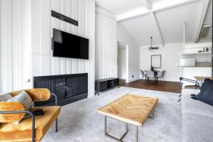 a living room with a couch and a fireplace at Culver City 2BR w Gym Pool nr shops LAX-328 in Los Angeles