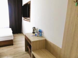 a room with a bed and a table in a room at Milten Skrzetuski in Wojcieszków