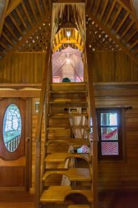 a wooden staircase in a room with a roof at Sabai Corner Bungalows - SHA Extra Plus in Ko Yao Noi