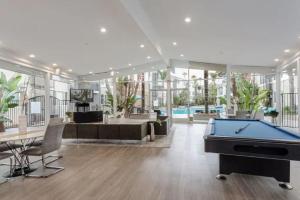 a large room with a pool table in it at Modern and Stylish Studio at 1200 Riverside in Burbank in Burbank
