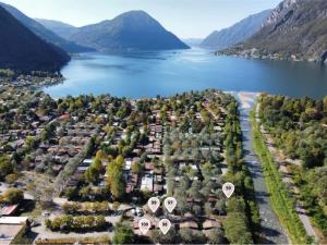 an aerial view of a town next to a lake at Brevar Vakantie - Porlezza in Porlezza