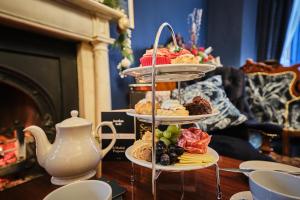 a three tiered display of pastries on a table at The Lawrence in Derry Londonderry