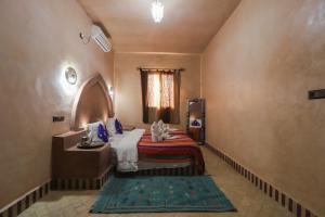 Postel nebo postele na pokoji v ubytování Maison Hassan Merzouga