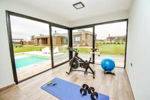 a room with a gym with a gym ball and a exercise bike at La Morada Almafuerte in Almafuerte