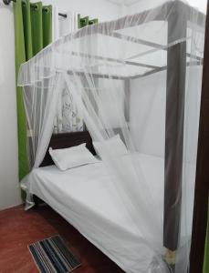 เตียงในห้องที่ Villa kandupamula