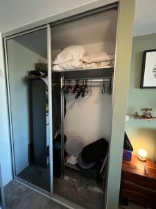 a room with a closet with a bunk bed at A cosy apartment near Crawley Station/Gatwick Airport in Crawley