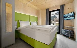 Łóżko lub łóżka w pokoju w obiekcie Aparthotel Zell am See (Contactless Check-In)