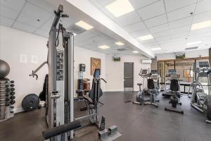a gym with several treadmills and exercise bikes at Slope-Side Serenity Ski-In Ski-Out Gem with Pool in Park City
