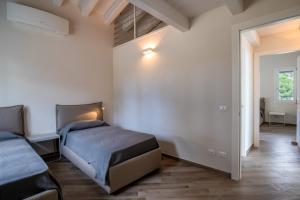 Postel nebo postele na pokoji v ubytování Villa Margidore