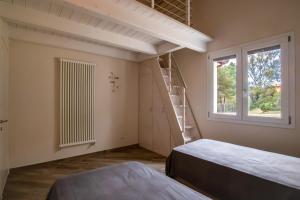 Postel nebo postele na pokoji v ubytování Villa Margidore