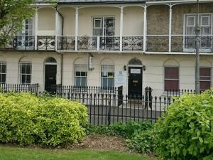 a building with a fence in front of it at Churchill Brighton in Brighton & Hove