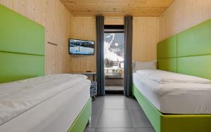 Łóżko lub łóżka w pokoju w obiekcie Aparthotel Zell am See (Contactless Check-In)