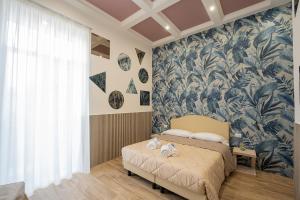 Posteľ alebo postele v izbe v ubytovaní P.C. Boutique H. De Gasperi, Napoli Centro, by ClaPa Group