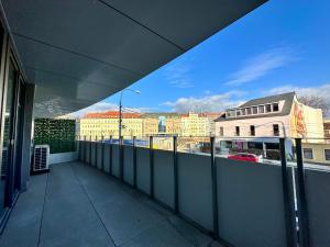an empty balcony with a view of a city at Vivien Modern City in Brno
