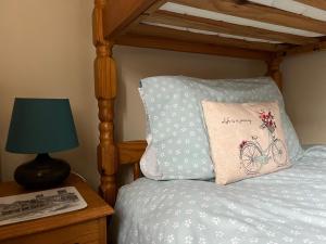 a bed with a pillow with a bicycle on it at 5 Union Road in Lincoln