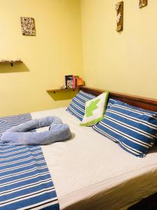 Postel nebo postele na pokoji v ubytování Unakuruwa Ravenala Homestay