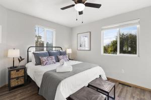 a bedroom with a bed with a ceiling fan at Bonfoy Guest House in Colorado Springs