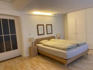 En eller flere senge i et værelse på Understadt 14 guesthouse