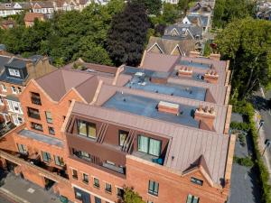 an aerial view of a brick building with a swimming pool at Richardson Deluxe Apartments (2-Bed) in London