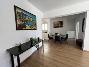 a living room with a table and a dining room at Prince Boutique Apartment/1BR in Nicosia +6 photos