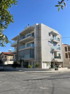 a largeartment building with people on top of it at Prince Boutique Apartment/1BR in Nicosia