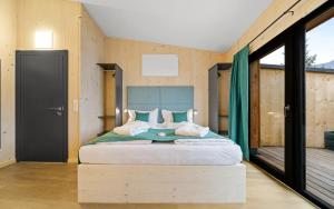 Łóżko lub łóżka w pokoju w obiekcie Aparthotel Zell am See (Contactless Check-In)