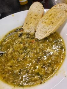 a bowl of guacamole with two pieces of bread at GRS Hotéis & Reservas Salinas Resort in Salinópolis