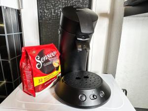 a coffee maker sitting on top of a counter at Little Dream in The City in Bremen