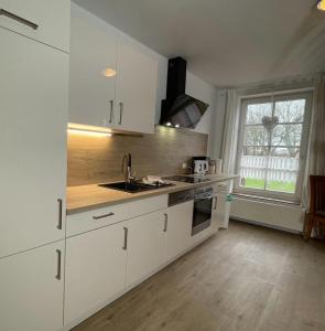 Kuchyň nebo kuchyňský kout v ubytování Gulfhof Greetsiel