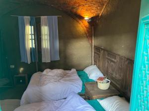 a bedroom with a large bed in the corner at Nassimah in Giza