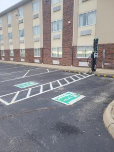 an empty parking lot in front of a building at Baymont by Wyndham Columbus/Rickenbacker in Columbus
