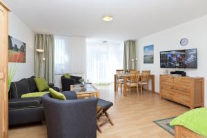 TV a/nebo společenská místnost v ubytování Am Seeufer 59b Fewo 3