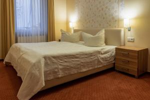 Postel nebo postele na pokoji v ubytování Hafendomicil Appartement WH02 - Hecht