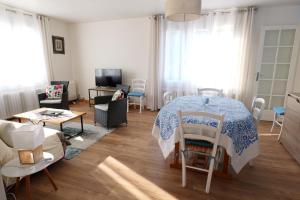 a bedroom with a bed and a living room at VILLA BOIS LAUZON in Orange