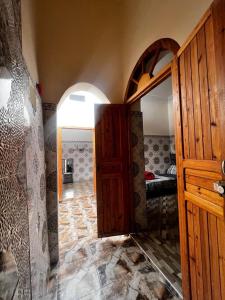 a room with an open door and a bedroom at Medina Stars in Rabat