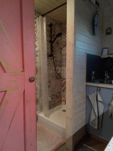 a bathroom with a shower and a bath tub at Maringotka_naluke in Detvianska Huta