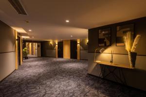 a corridor of a hotel with a hallway with at Kenzi Solazur in Tangier